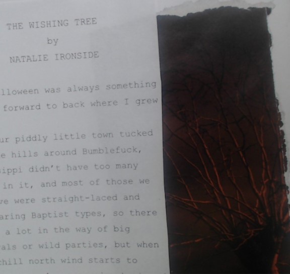 shot of a zine interior, text in courier on the left, a tree in red and black on the right. the text is cut off somewhat but reads, in part, “The Wishing Tree by Natalie Ironside.” It references a small town in Mississippi in the Halloween season….